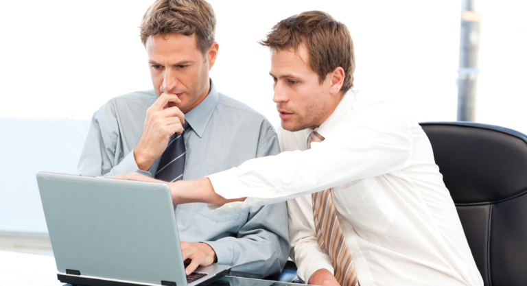 Men looking at laptop