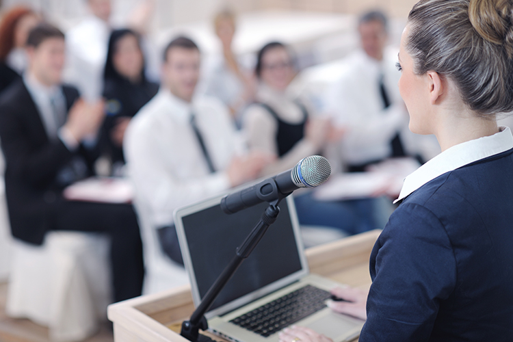 Woman presenting with laptop