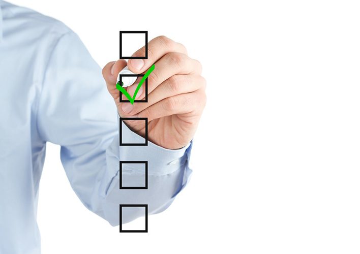 Man drawing green tick on checkbox