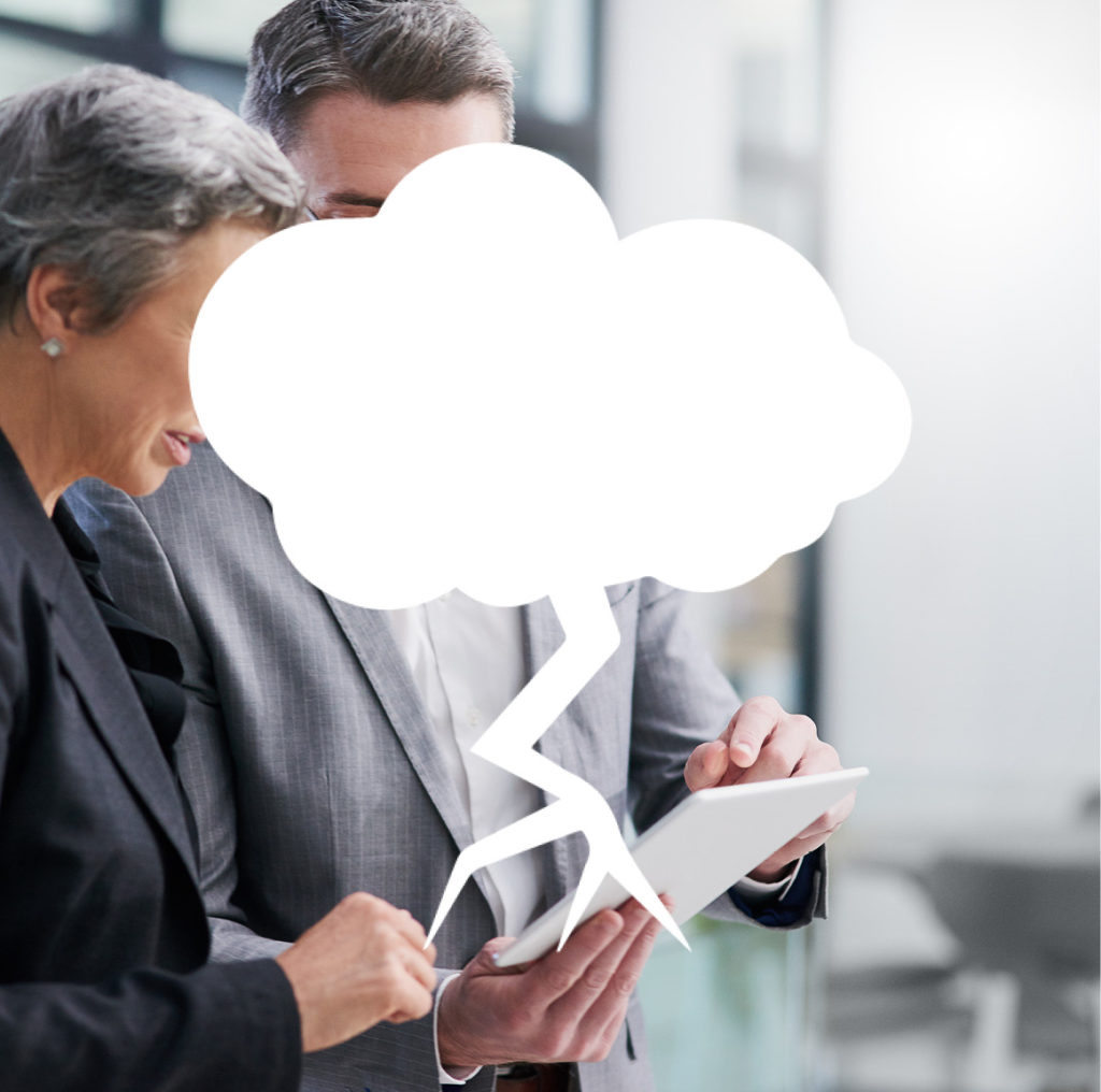 Business man and woman looking at tablet with thunder cloud overlay