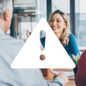 Woman smiling during business meeting