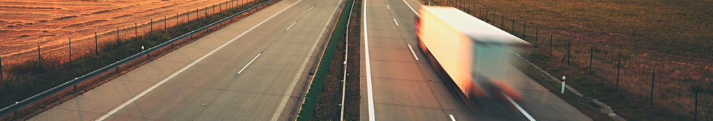 Lorry travelling along empty road