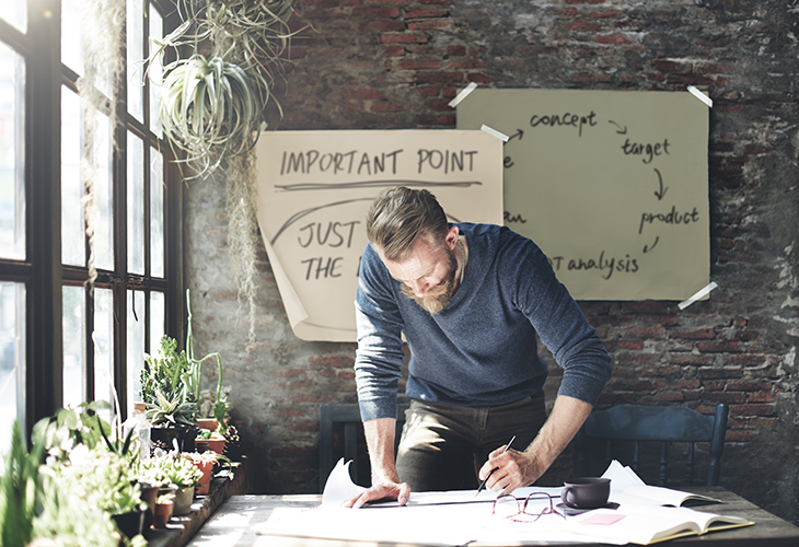 Man working on table in studio