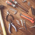 Selection of tools on a wooden workbench