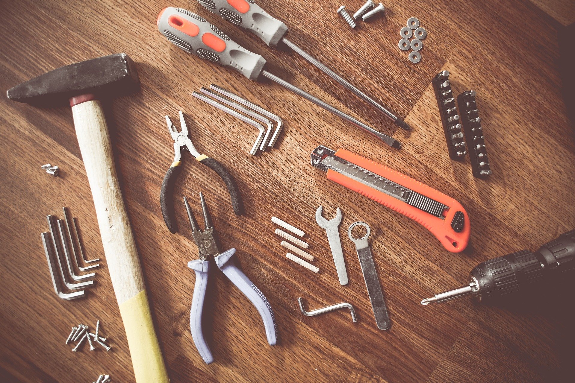 Selection of tools on a wooden workbench
