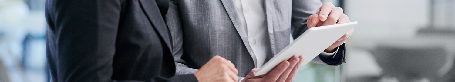 Business men looking a paper report
