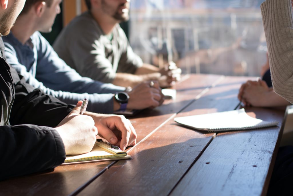 Meeting in office on wooden table