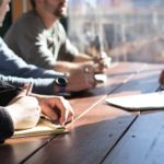 Meeting in office on wooden table