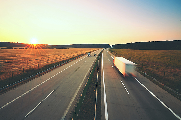 Lorry travelling along empty road