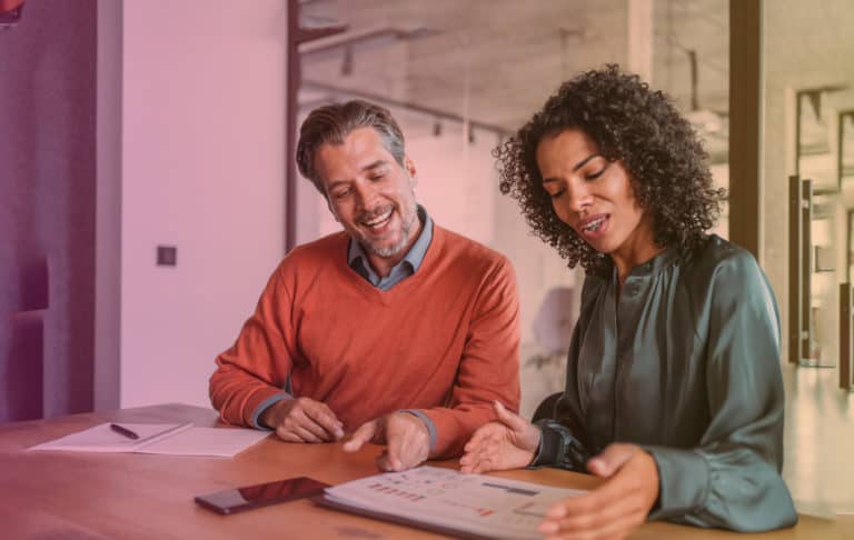 Man and woman working together on a task.