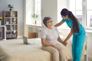 A care worker assisting a patient